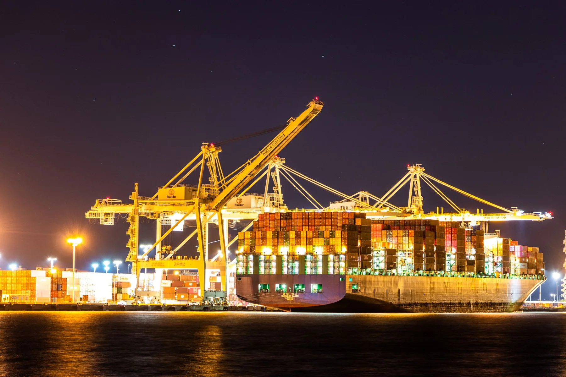 Container ship at an illuminated international port